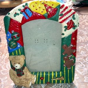 CHRISTMAS PHOTO FRAME 5 1/2” x 6 3/4” has teddy bear, gift, bugle.  $10